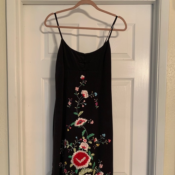Black dress with flower design and shall.